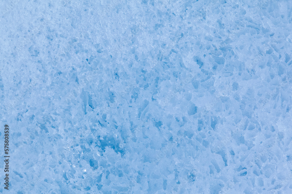 Texture of winter ice surface. Blue natural ice background Texture of winter ice surface. Blue natural ice background