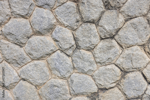 Stone background in a resort gives a feeling of solidity, strength, luxury.