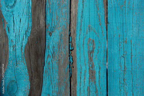 Old painted blue boards of the old fence