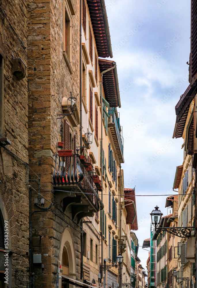 Gothic buildings on a narrow street in Centro Storico of Florence, Italy