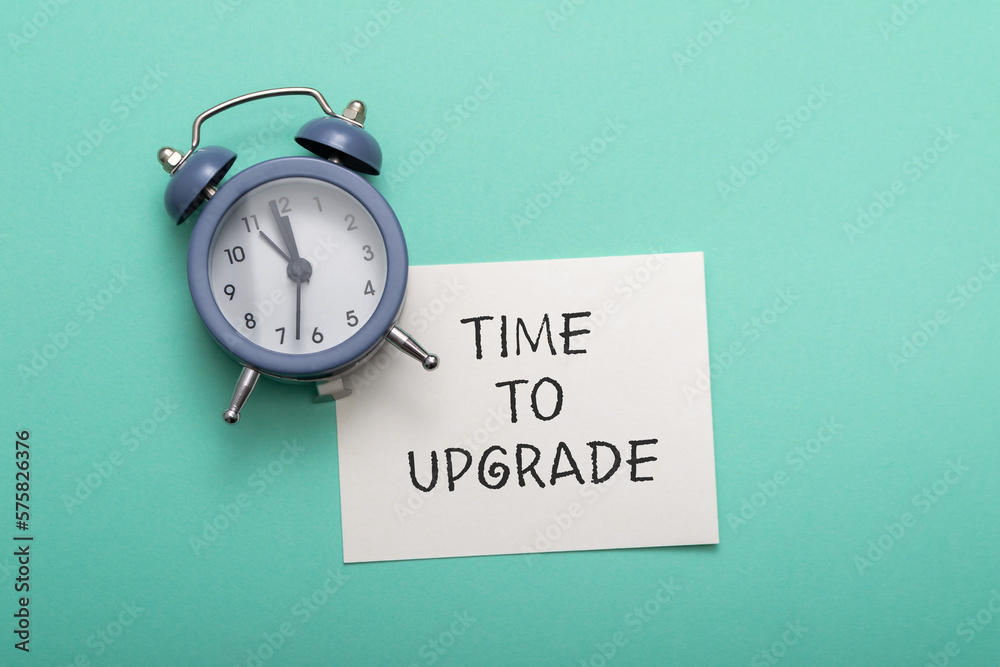 Composition with text Time to Upgrade on cyan background Composition with text Time to Upgrade on cyan background