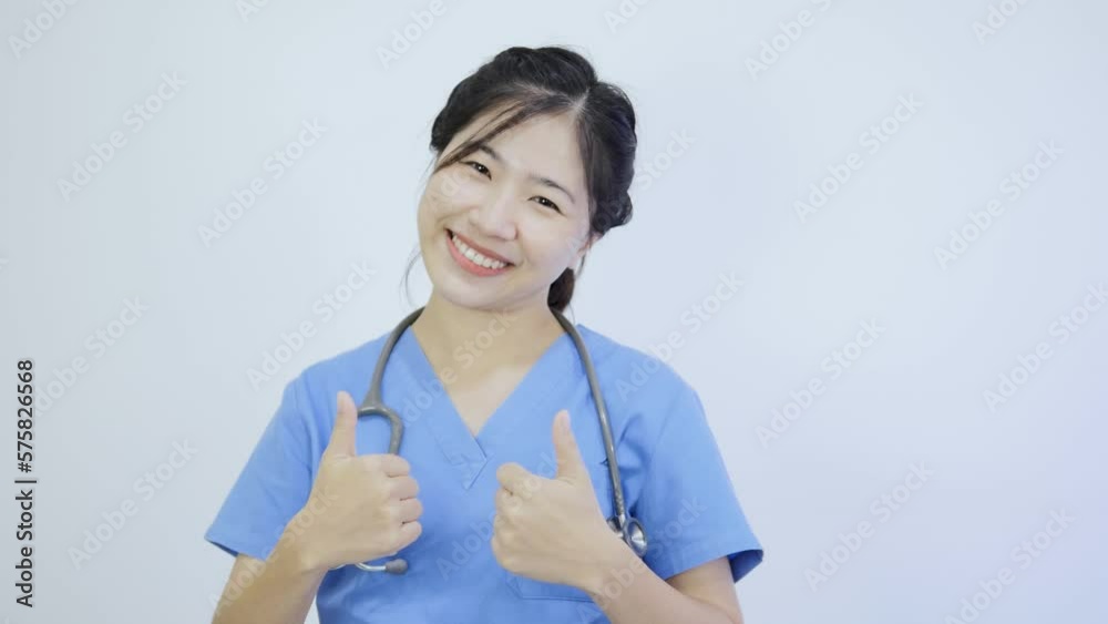 Stock video of Asian female doctor raising her hand showing great Stock video of Asian female doctor raising her hand showing great