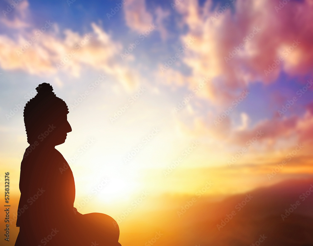 Silhouette of Buddha on golden  sunset background