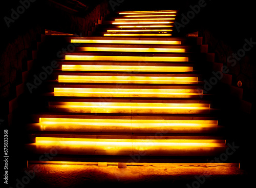 Steps on the stairs at night in the illumination of lanterns.