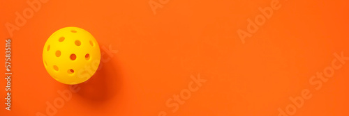 Pickleball on orange banner