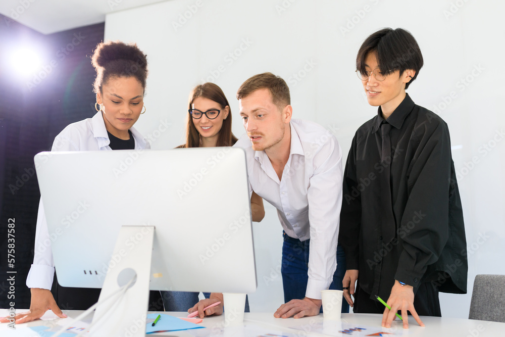 A multinational team works in the office A multinational team works in the office