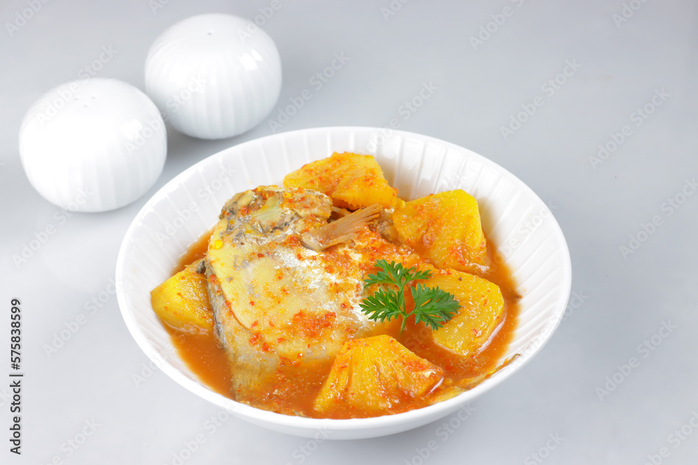 Gulai Nenas is a Malaysian Traditional Dish, Pineapple in Coconut Gravy with Fish. Pineapple Curry with Fish. Gulai Nenas is a Malaysian Traditional Dish, Pineapple in Coconut Gravy with Fish. Pineapple Curry with Fish.