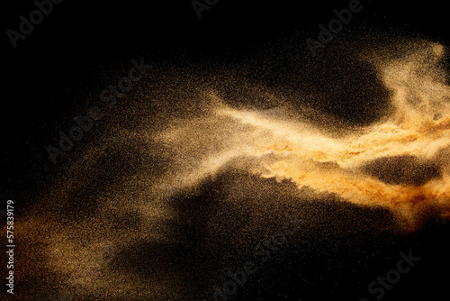 Sand explosion isolated on black background. Freeze motion of sandy dust splash.Sand texture concept.