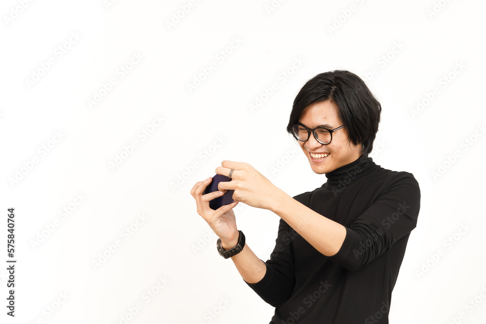Playing Mobile Game on Smartphone Of Handsome Asian Man Isolated On White Background Playing Mobile Game on Smartphone Of Handsome Asian Man Isolated On White Background