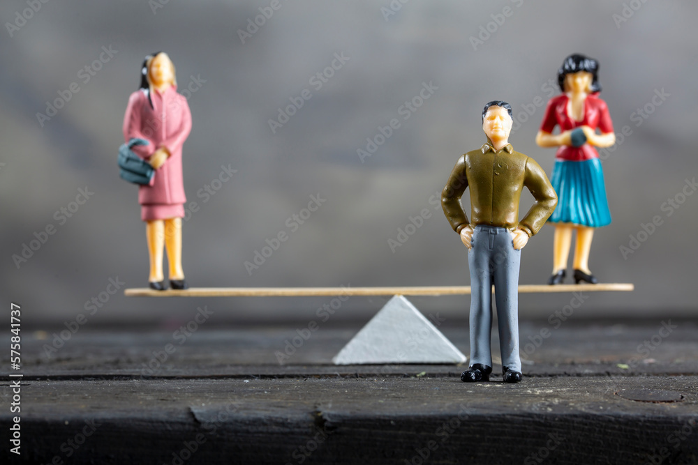 Concept image of marriage choice.   two woman balancing  in seesaw  