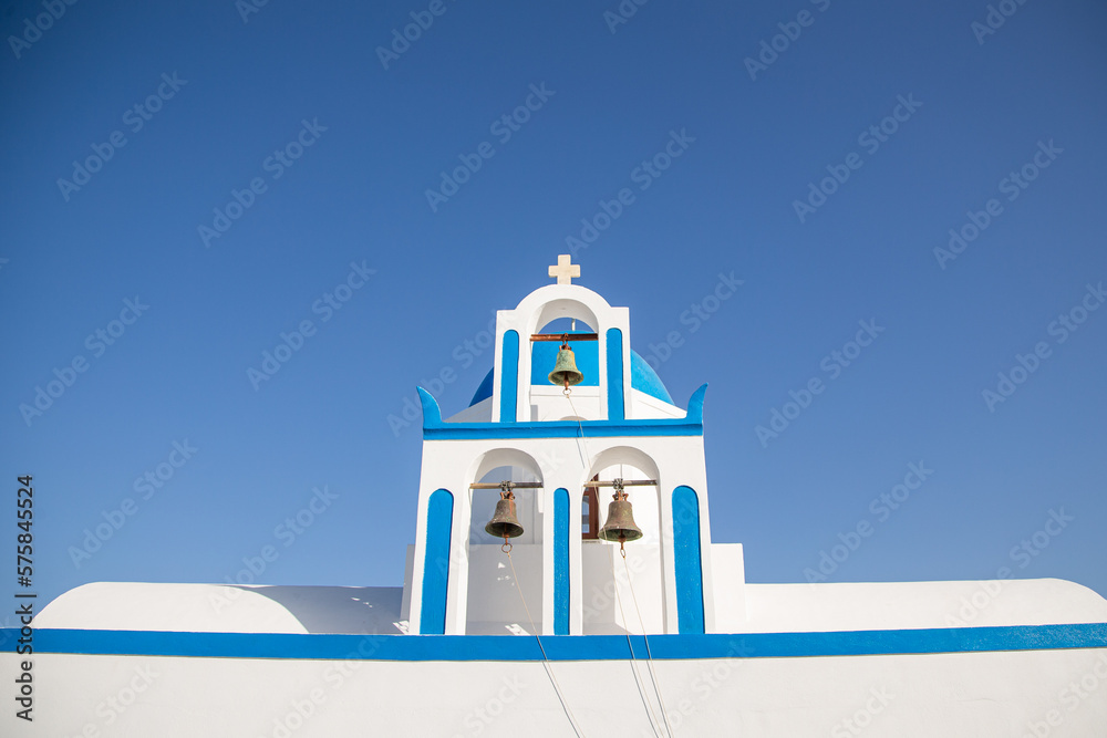 Domes, steeples, bells and white buildings of Santorini, Greece Domes, steeples, bells and white buildings of Santorini, Greece