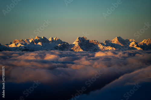 sunset over a sea of clouds in winter photo