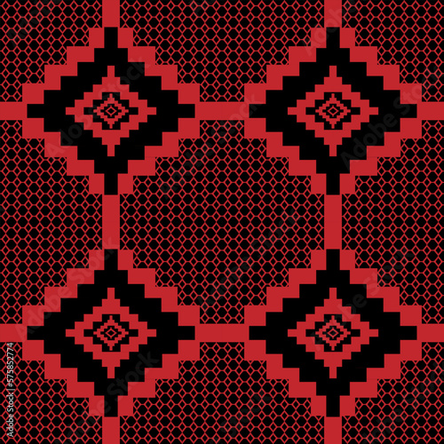 Seamless fabric geometric pattern in red on a black background.