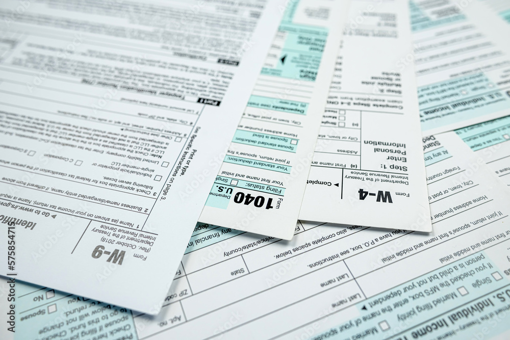 closeup of 1040 US personal income tax form on desk closeup of 1040 US personal income tax form on desk