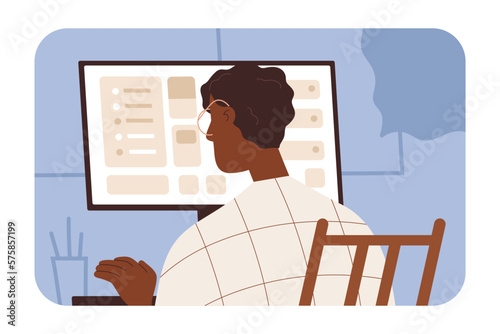 Employee, black man works at desktop computer. Office worker sitting at desk. African-American business person working at workplace, looking at screen, monitor, back view. Flat vector illustration