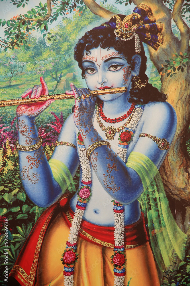 Painting depicting Hindu god Krishna playing a flute outdoors. India.