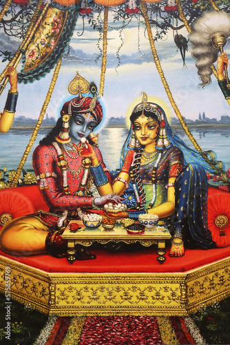 Painting depicting Hindu god Krishna sitting with his consort Radha. India. photo
