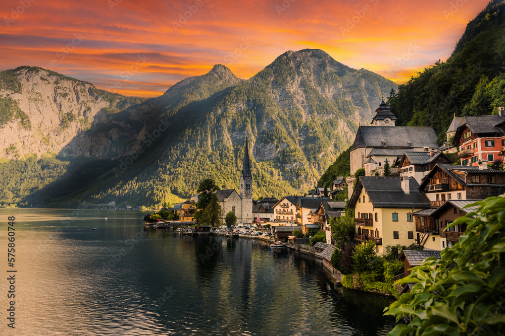 Fototapeta premium Hallstatt town with reflection in lake with sunset sky, Austria