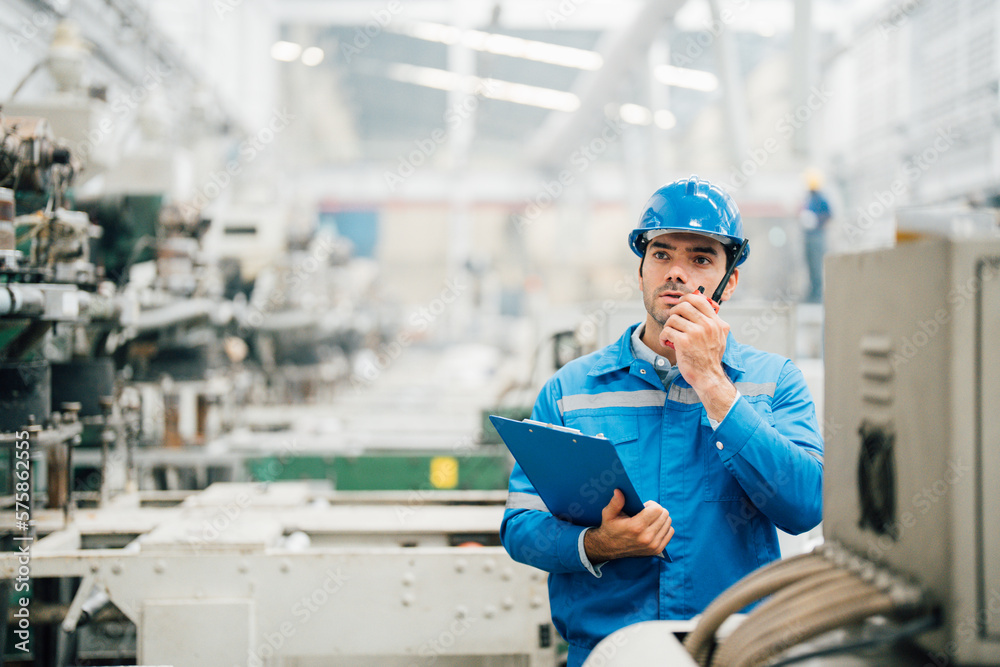 Professional Engineering of modern factory checking to automatic machinery. Engineering with clipboard Programmable Logic Controller to manage large machine working full automatic. Professional Engineering of modern factory checking to automatic machinery. Engineering with clipboard Programmable Logic Controller to manage large machine working full automatic.