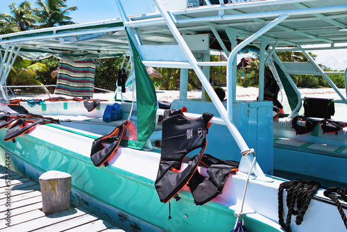 Life jackets on board of tourist boat docked at Isla Contoy, Mexico photo