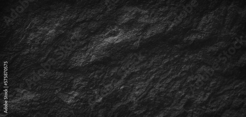Dark gray black slate stone background or texture, horizontal shape with space for design. Web banner. Wide. Panoramic. Website header