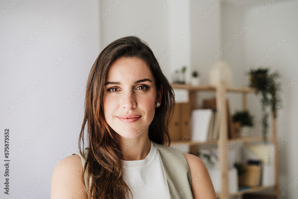 Confident smiling businesswoman in office