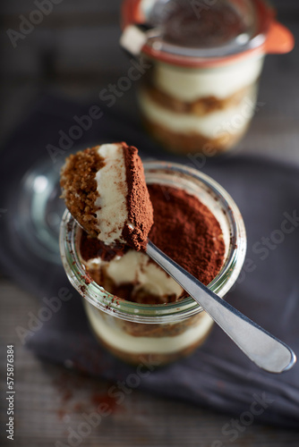Spoon in jar of tiramisu photo