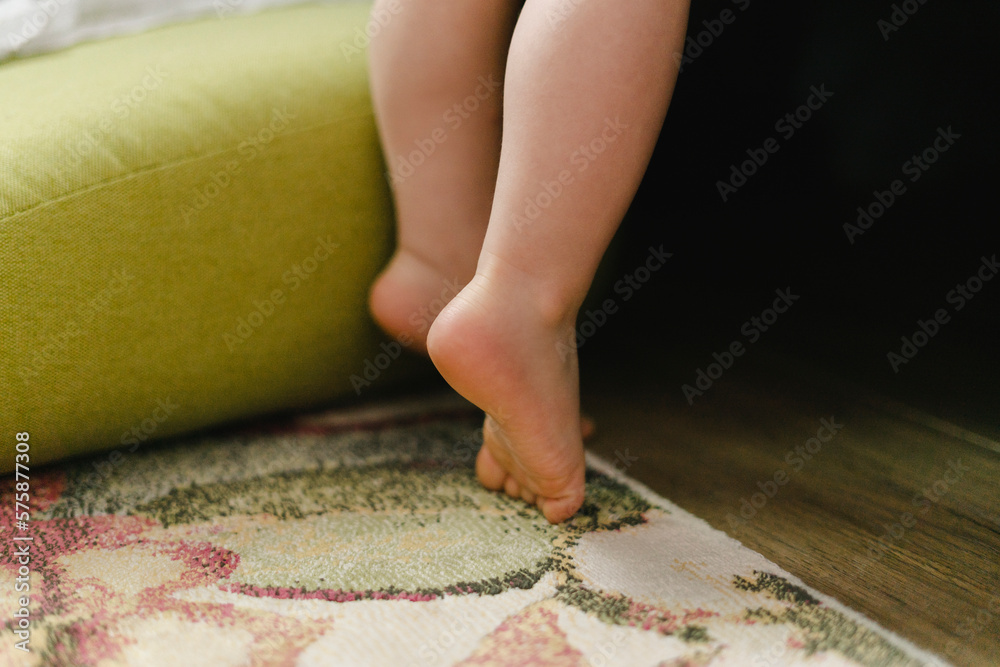 Boy standing on toes at home Boy standing on toes at home