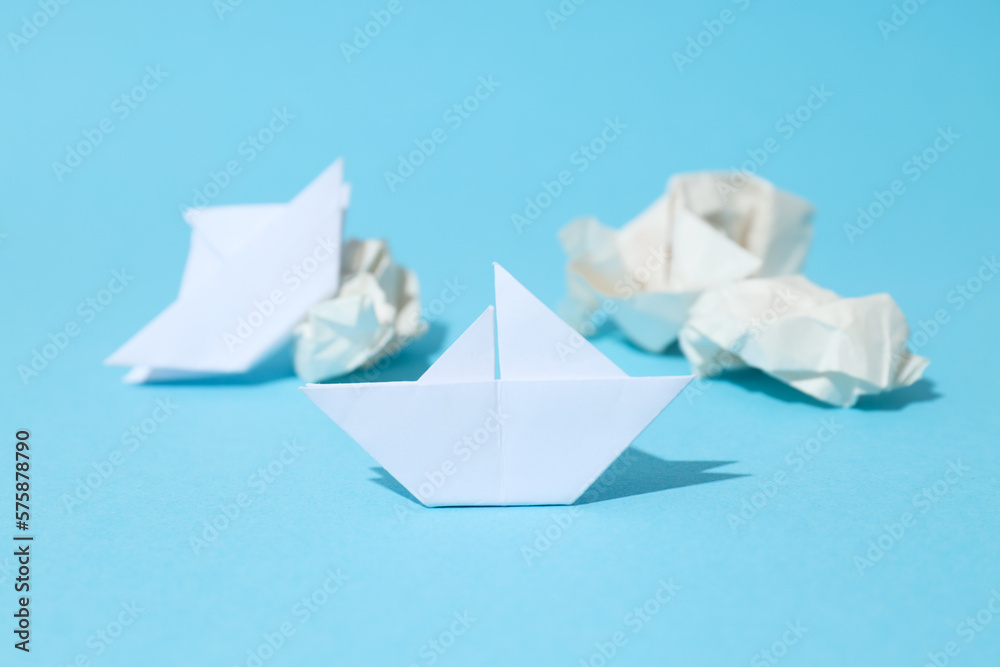 Concept of business competition with paper boats Concept of business competition with paper boats