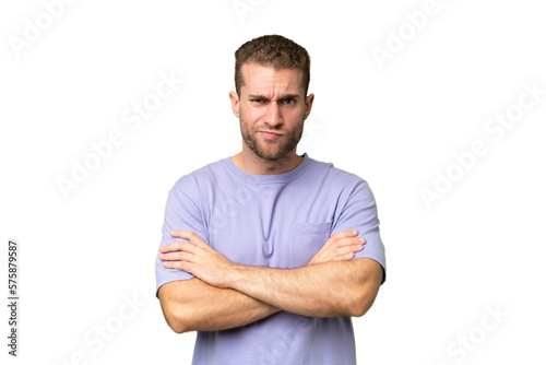 Young handsome caucasian man isolated on green chroma background feeling upset