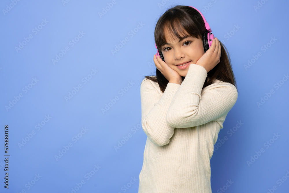 Photo of sweet funny young girl wear earphones dancing enjoying music isolated purple color background Photo of sweet funny young girl wear earphones dancing enjoying music isolated purple color background