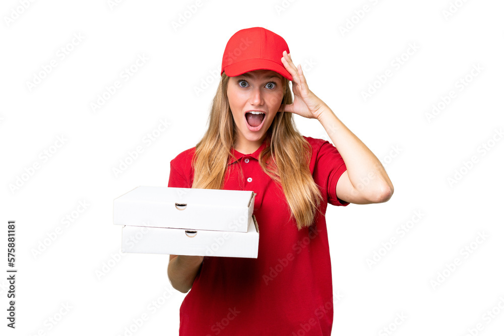 Young caucasian pizza delivery woman with work uniform picking up pizza boxes over isolated background with surprise expression Young caucasian pizza delivery woman with work uniform picking up pizza boxes over isolated background with surprise expression