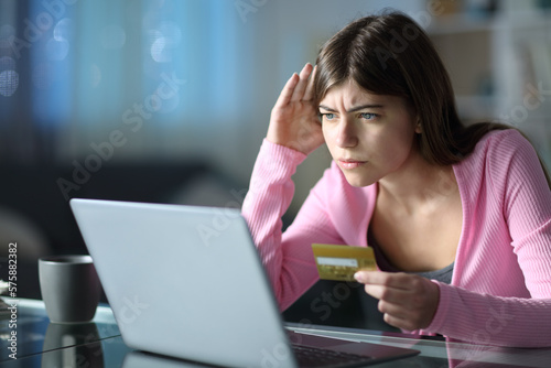 Vászonkép Worried teen having problem buying online
