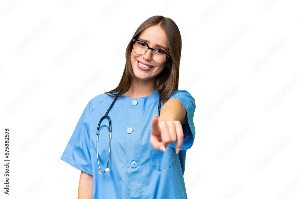 Young nurse caucasian woman over isolated background points finger at you with a confident expression Young nurse caucasian woman over isolated background points finger at you with a confident expression