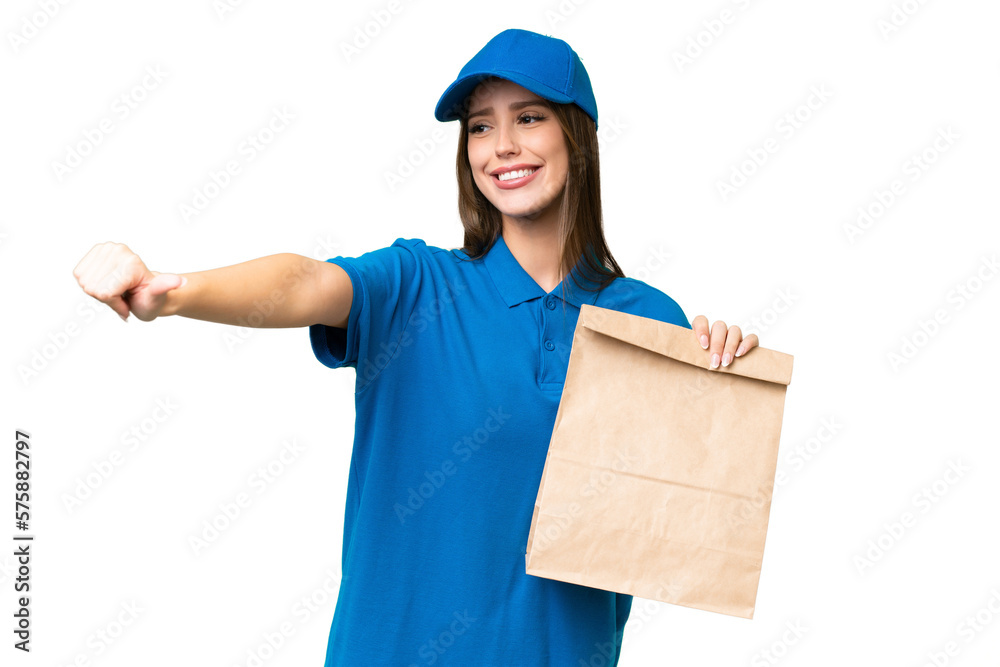Young beautiful caucasian woman taking a bag of takeaway food over isolated background giving a thumbs up gesture Young beautiful caucasian woman taking a bag of takeaway food over isolated background giving a thumbs up gesture