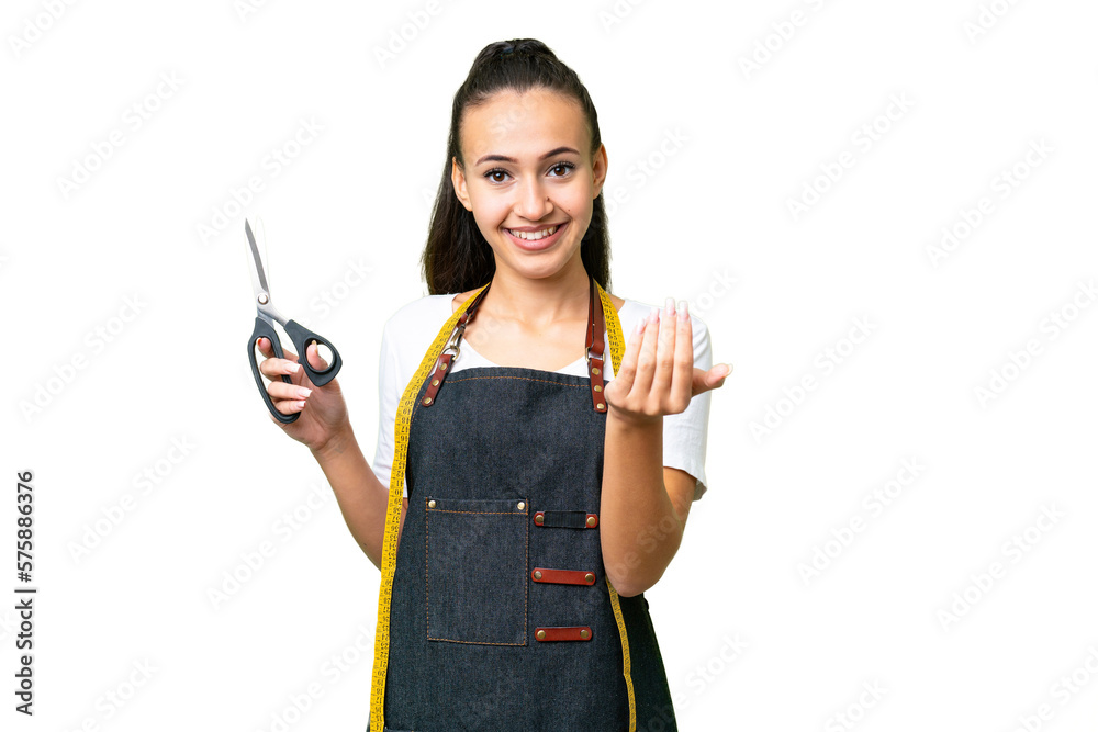 Young Seamstress woman over isolated chroma key background inviting to come with hand. Happy that you came