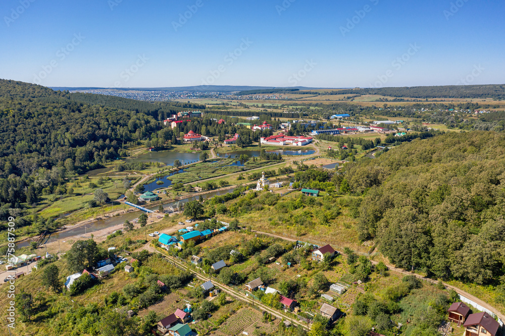 South Urals, General view of the valley of Krasnousolsk resort: territory of sanatorium, and Church of the Tabyn icon of the mother of God. Aerial view.