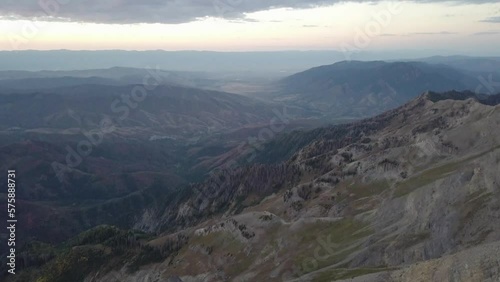 mt nebo at early morning sunrise overlooking the valley in salt lake city utah - AERIAL RISE TILT photo