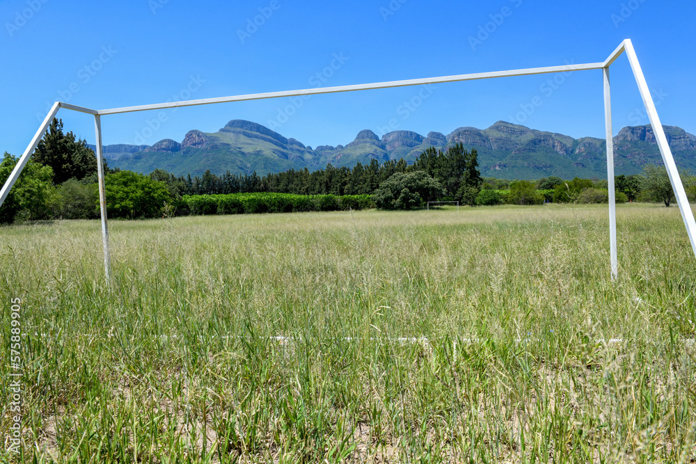 Football field with view at the mountains of Blyde river canyon in South Africa