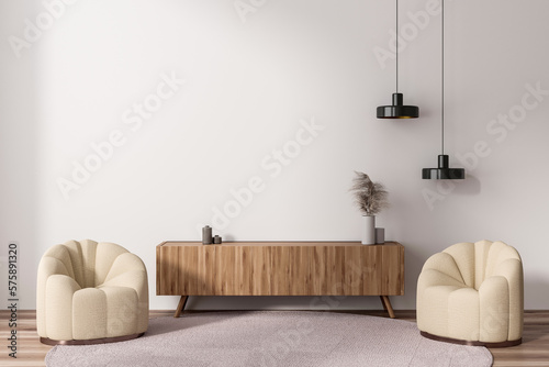 Fotografia Stylish living room interior with two seats and sideboard