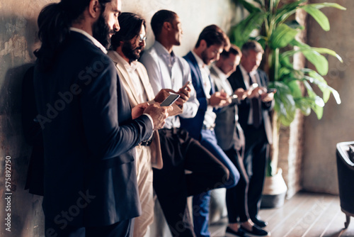 large group of business people all busy on mobile phone