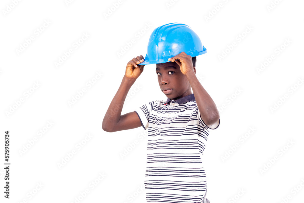 portrait of a young boy adjusting safety hat.