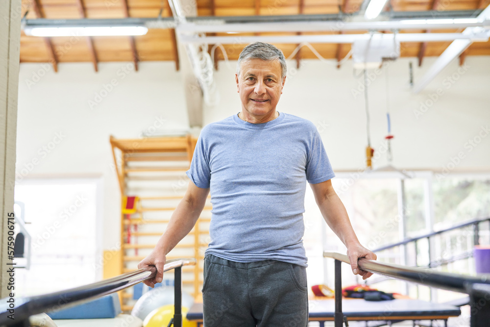 Senior man exercising on ramp at rehab center