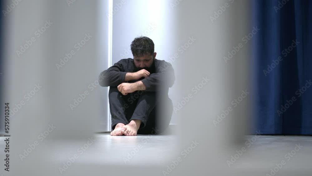 Man sitting alone felling sad worry or fear and hands up on head on black background
Man sitting alone felling sad worry or fear and hands up on head on black background
