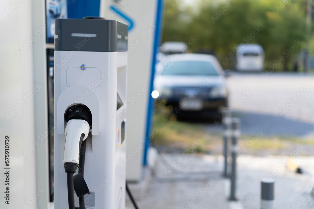 Fast electric vehicle car charger and power supply box at EV station sites. Fast electric vehicle car charger and power supply box at EV station sites.