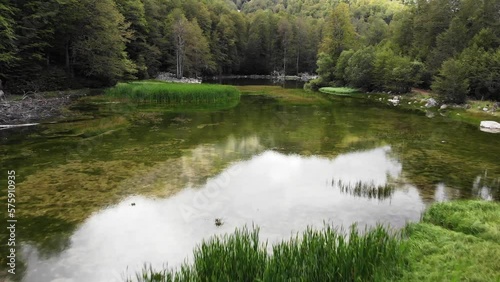 Drone video over mountain alpine lake Moutsalia Gramos summer low angle photo