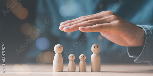 Male hand Represents the protection and protection of family safety, Insurance management planning ,health care and finance ,property and family risk reduction,life and property protection planning
