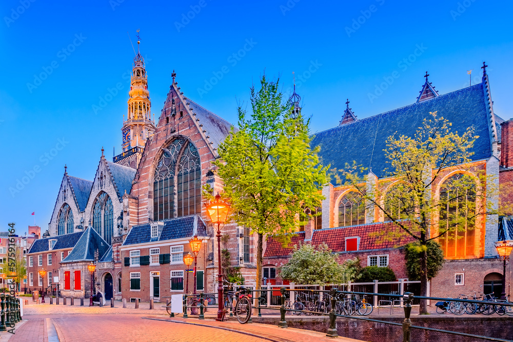 Amsterdam, Netherlands. The Oude Kerk (church) at twilight.