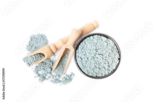 Blue spirulina powder in bowl isolated on white background. SUPERFOOD photo