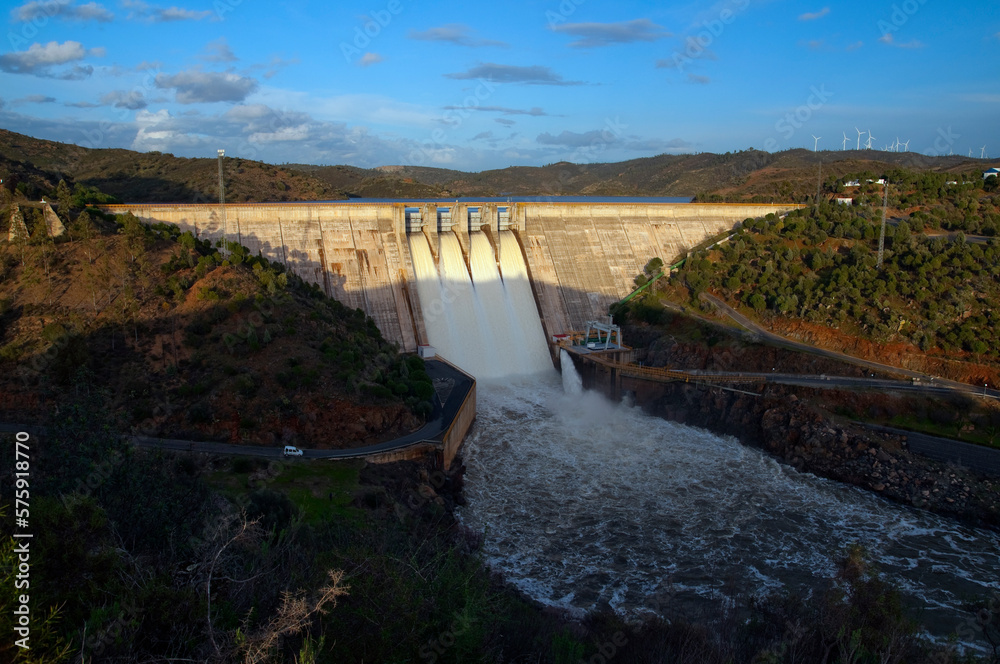 reservoir with open gates to produce electricity